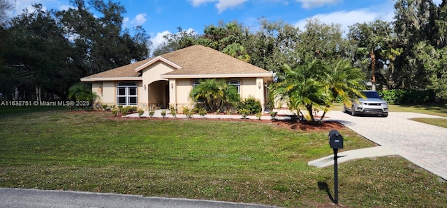 single story home with a front yard