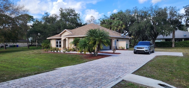 ranch-style house with a garage and a front lawn