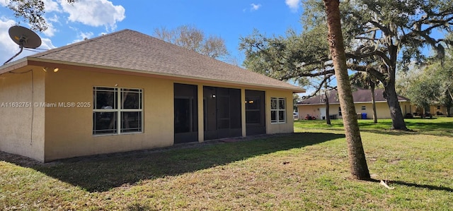 exterior space with a lawn and a sunroom