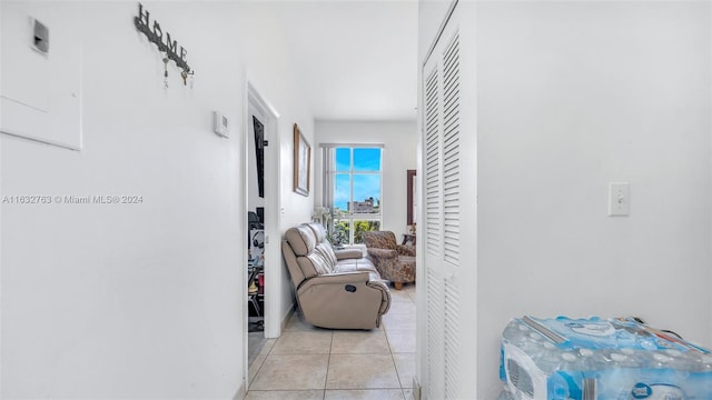 hallway with light tile patterned floors