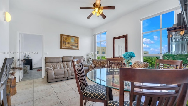 dining room with a ceiling fan and light tile patterned flooring