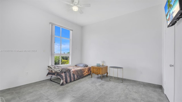 bedroom with light tile patterned floors and ceiling fan