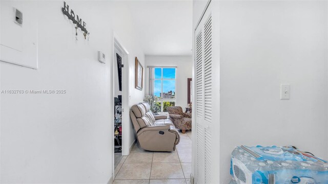 tiled bedroom featuring connected bathroom