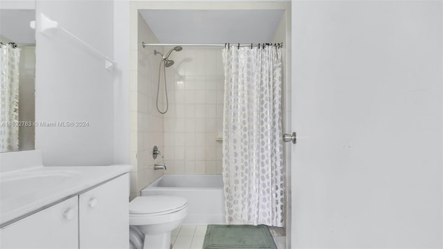 full bathroom featuring toilet, tile patterned floors, shower / bathtub combination with curtain, and vanity