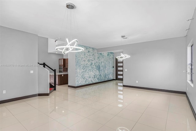 unfurnished room featuring light tile patterned floors and an inviting chandelier