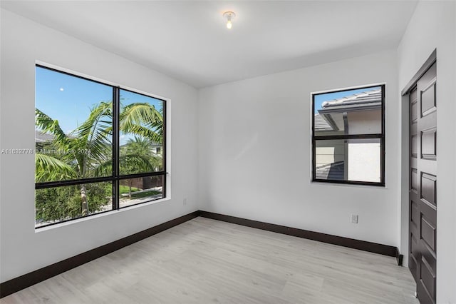 unfurnished room featuring light wood-type flooring