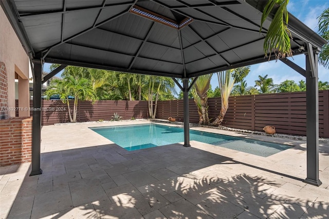 view of pool with a patio area and a gazebo