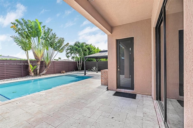 view of pool featuring a patio area and a gazebo