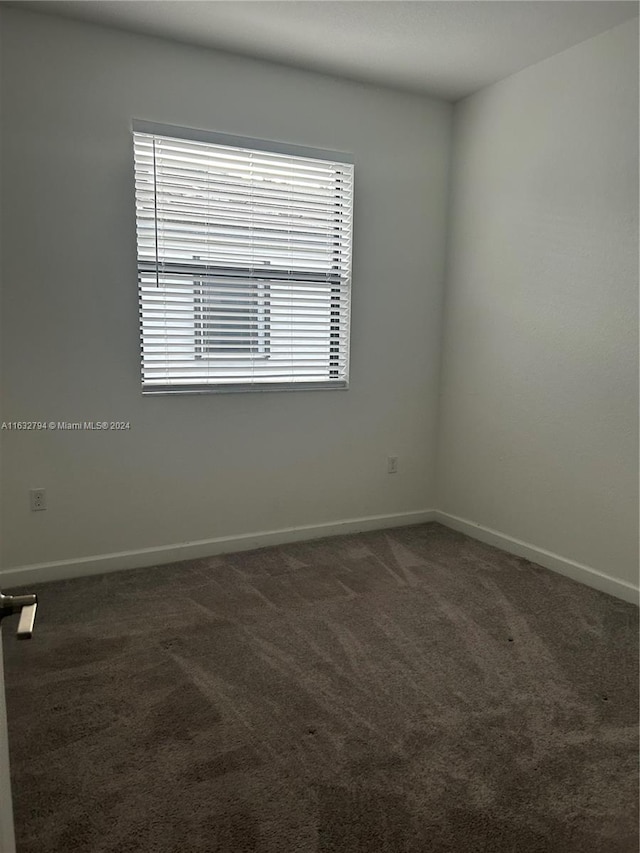 empty room with carpet flooring