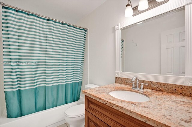 full bathroom featuring vanity, shower / bathtub combination with curtain, and toilet