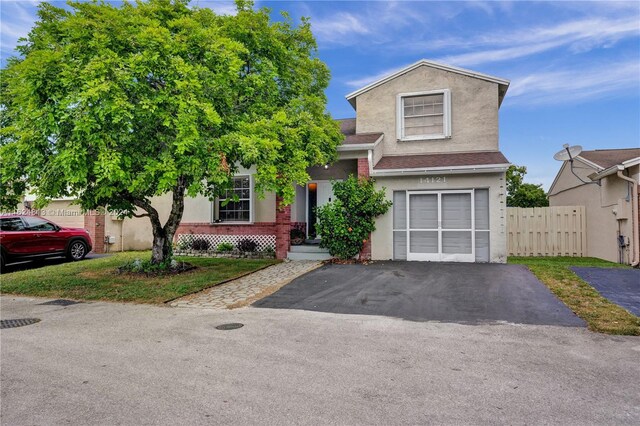 view of front of property with a garage