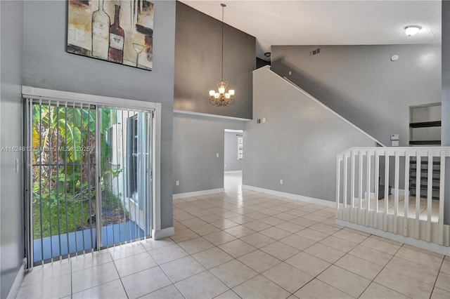 interior space with a chandelier, visible vents, plenty of natural light, and baseboards