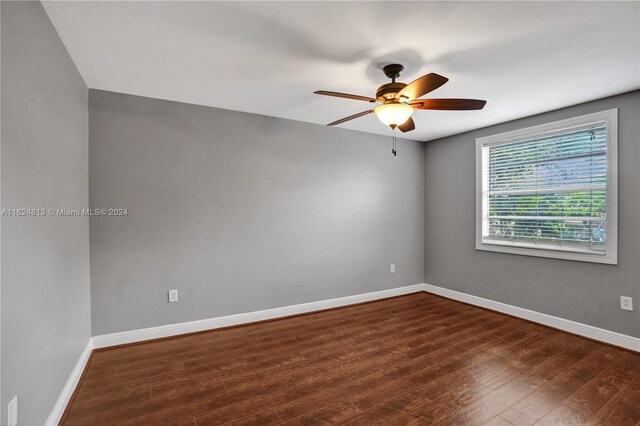 unfurnished room featuring hardwood / wood-style flooring and ceiling fan