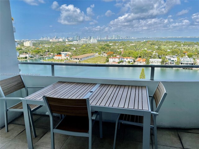 balcony featuring a water view