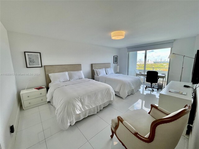 bedroom with light tile patterned floors