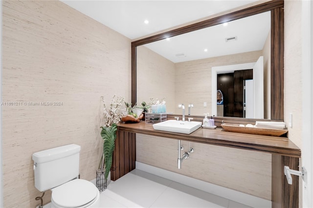 bathroom with tile patterned floors, vanity, and toilet