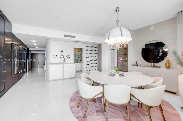 dining area featuring a notable chandelier