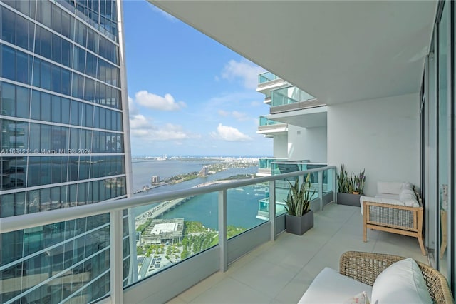 balcony featuring a water view