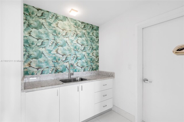 bathroom with tile patterned flooring and vanity