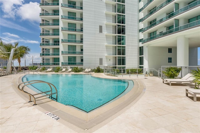 view of swimming pool with a patio area