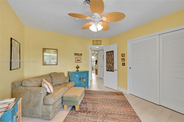 living room featuring a ceiling fan