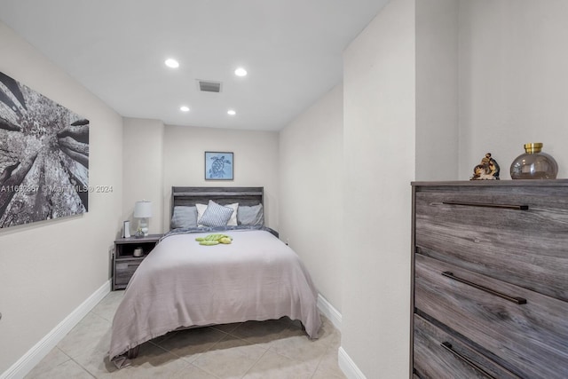 bedroom with light tile patterned floors