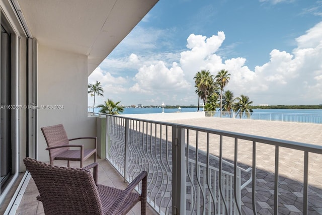 balcony featuring a water view