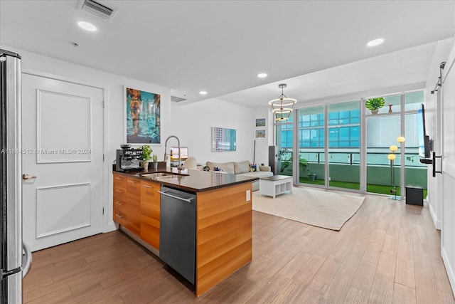 kitchen with sink, light hardwood / wood-style flooring, a wall of windows, dishwasher, and kitchen peninsula