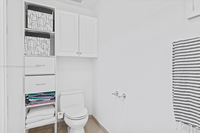 bathroom featuring tile patterned floors and toilet