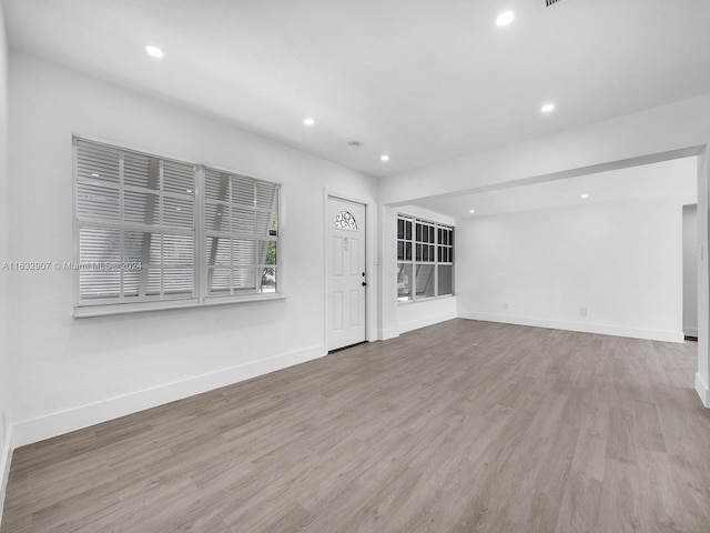 unfurnished living room featuring light hardwood / wood-style flooring