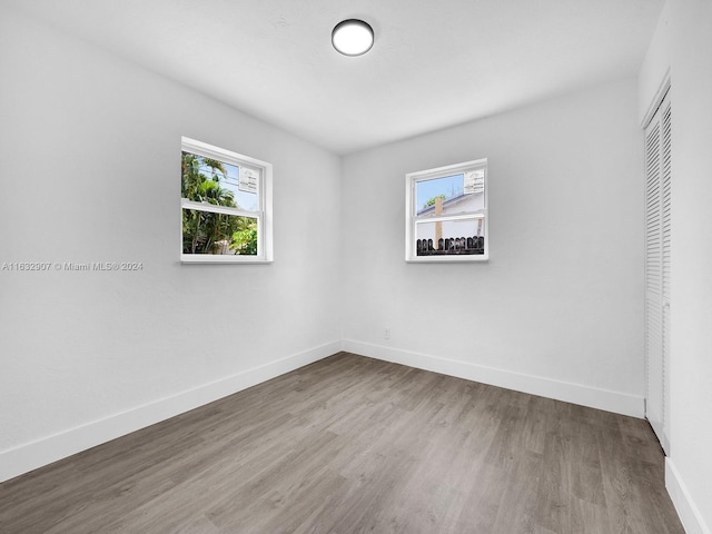 unfurnished room featuring hardwood / wood-style floors