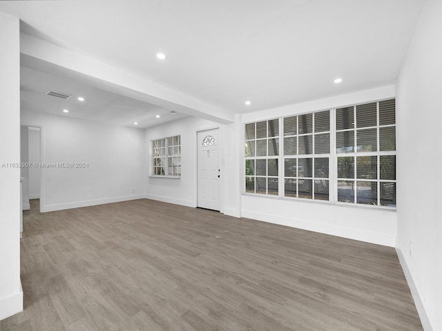 spare room with hardwood / wood-style flooring