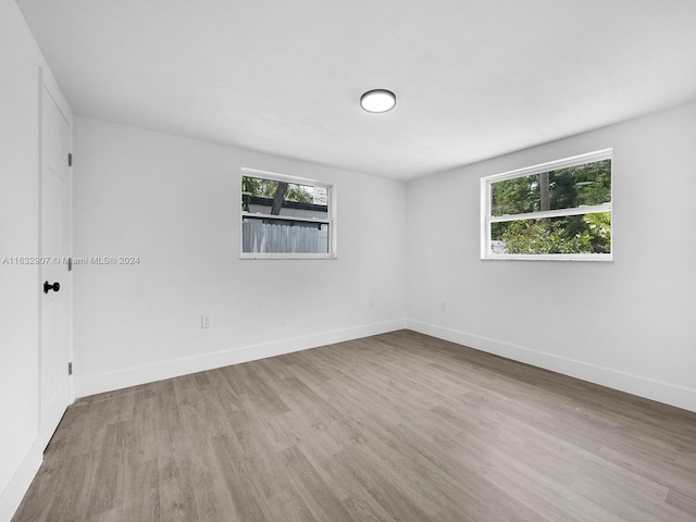 unfurnished room featuring light hardwood / wood-style floors