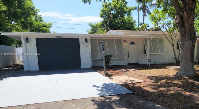 single story home featuring a garage