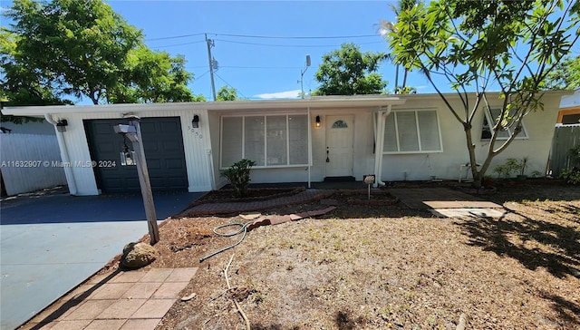 single story home featuring a garage