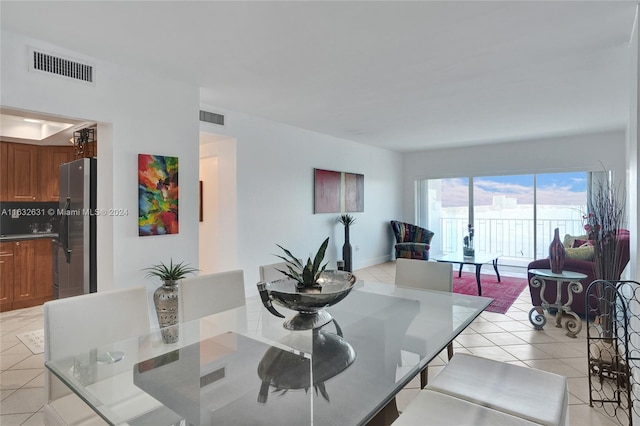 dining space with light tile patterned floors