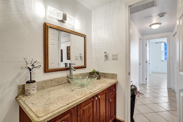 bathroom featuring vanity and tile patterned flooring