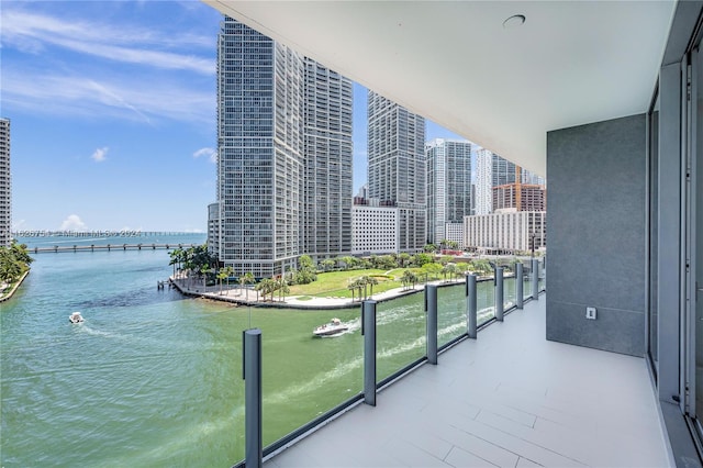 balcony featuring a water view