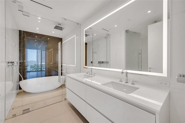 bathroom featuring dual vanity, independent shower and bath, and tile patterned flooring