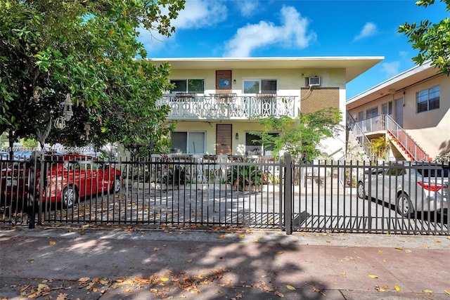 view of front of house with a balcony