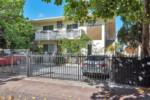 view of front of home with a balcony