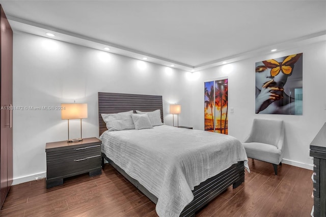 bedroom featuring dark hardwood / wood-style floors