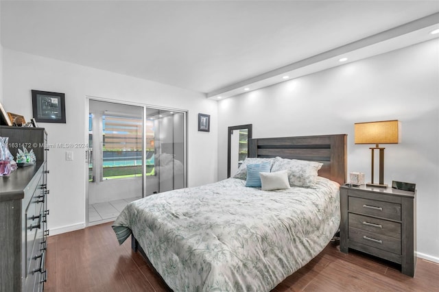 bedroom with dark wood-type flooring