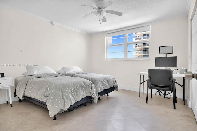 bedroom featuring ceiling fan, ornamental molding, and a textured ceiling