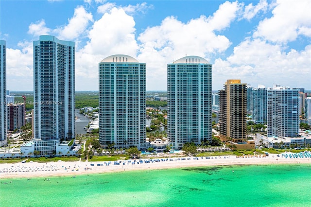 view of city with a water view and a beach view