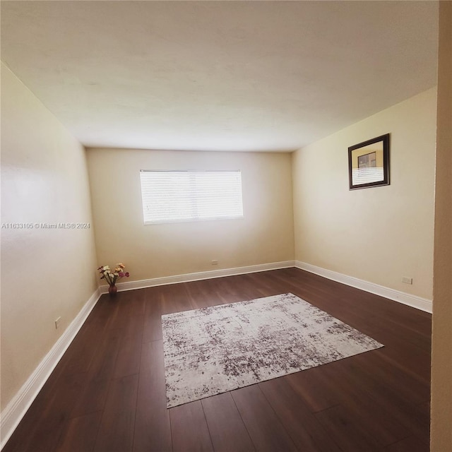 empty room featuring dark hardwood / wood-style floors