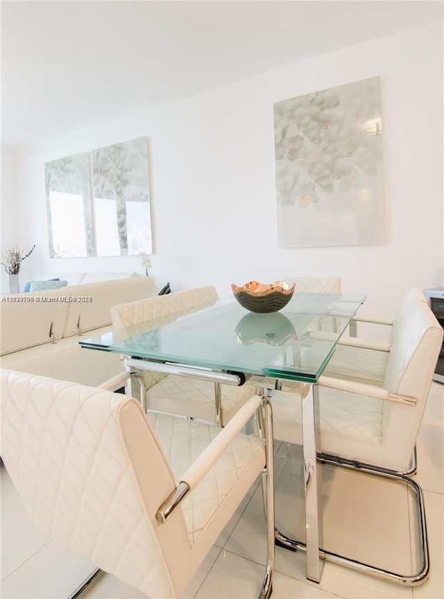 dining space featuring tile patterned flooring