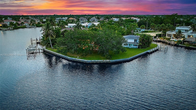 aerial view at dusk with a water view