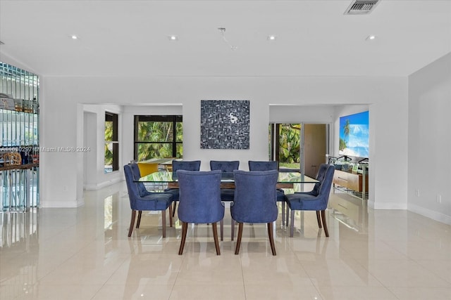 tiled dining area with plenty of natural light