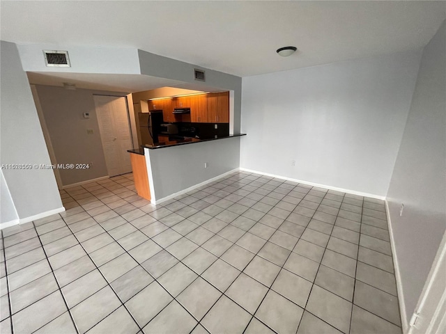 interior space with light tile patterned floors